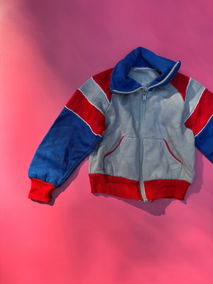 Children's red, white, and blue jacket on a pink background